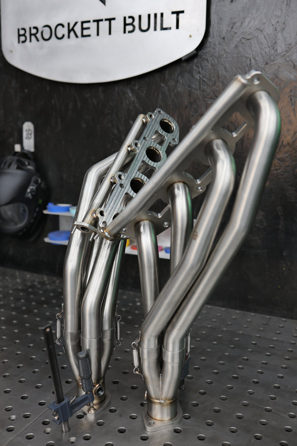 304 stainless 2UZ-FE mid-length headers, a Brockett Built production part