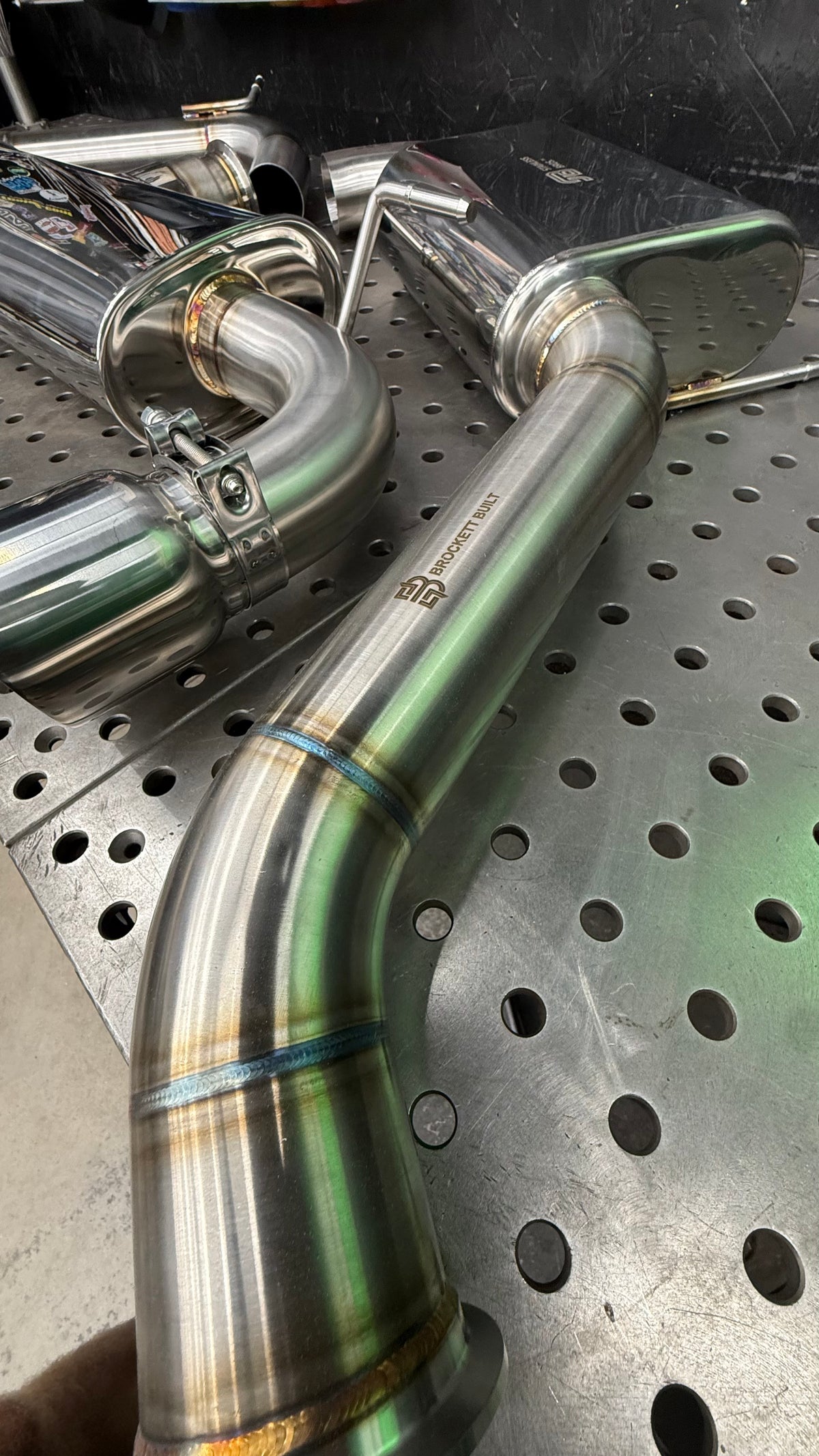 TIG welded, back purged 304 stainless bends on the GTI Stealth cat-back with a band clamp joint and etched Brockett Built logo