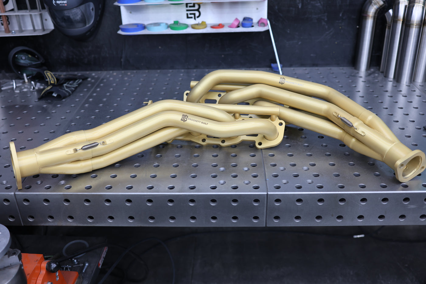 Gold Cerakote applied to exhaust header showing finished appearance