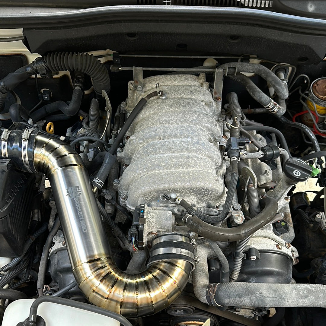GX470 titanium intake installed in engine bay showing airbox connection