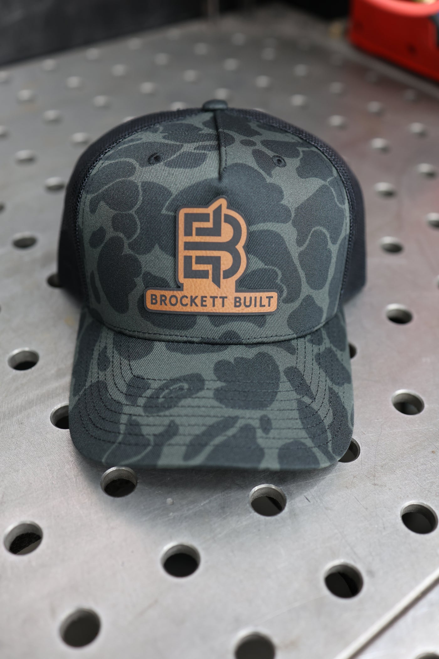 Brockett Built snapback hat logo close-up on front panel
