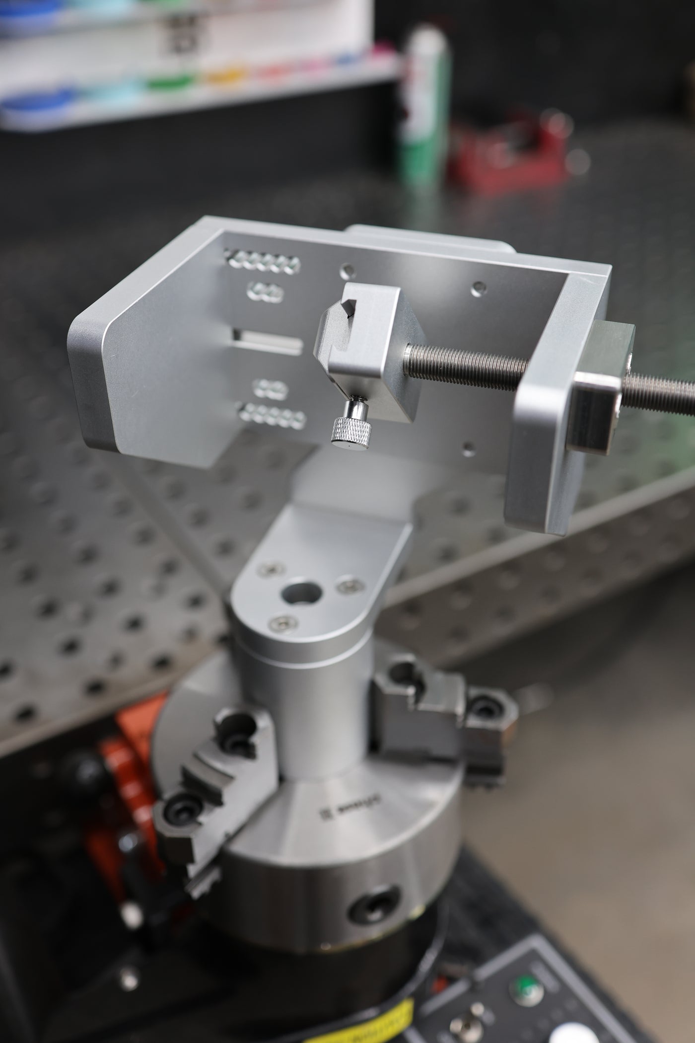Overhead view of the Brockett Built Tube Fixture showing the V-block, leadscrew and pass-thru opening