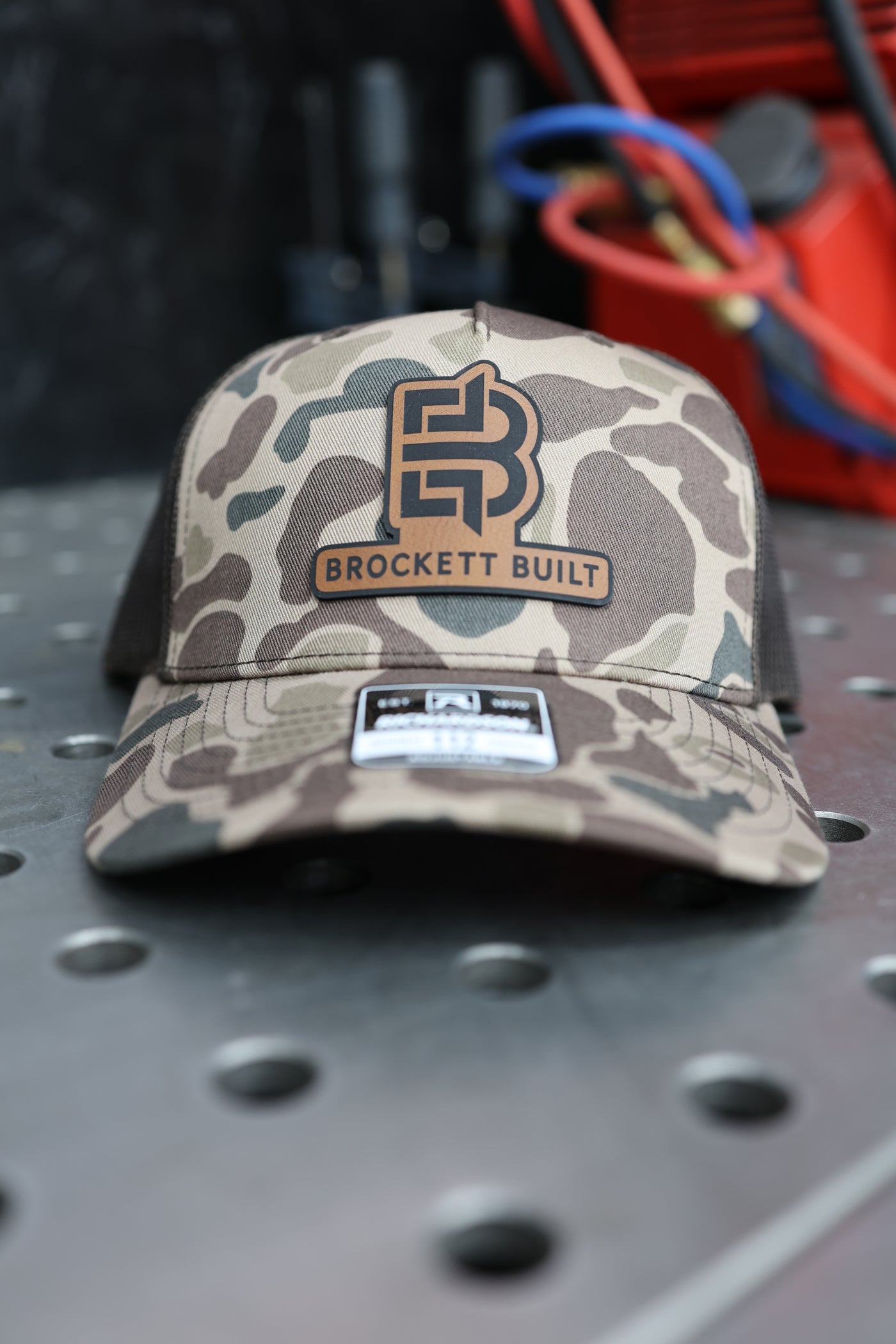 Brockett Built snapback in Sable Duck Camo with black brim front view