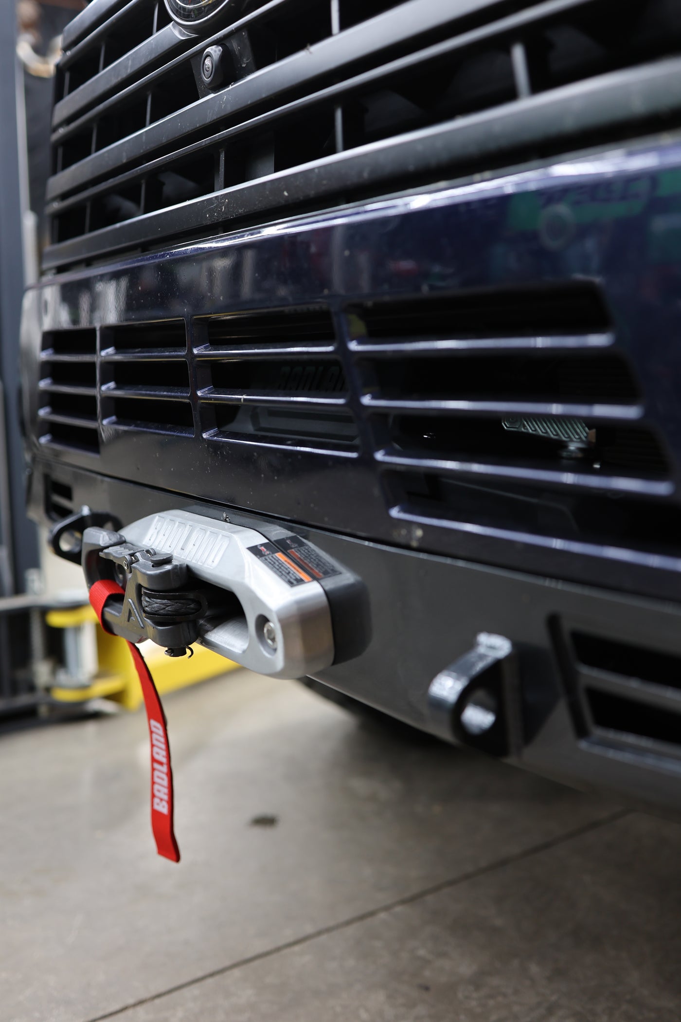 GX550 winch bumper installed showing driver side light mount tab