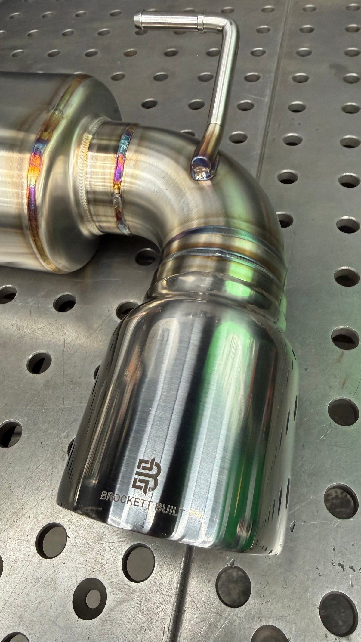 Jones 4in slant-cut tip with laser-etched Brockett Built logo on the BRZ GR86 dual-exit axle-back