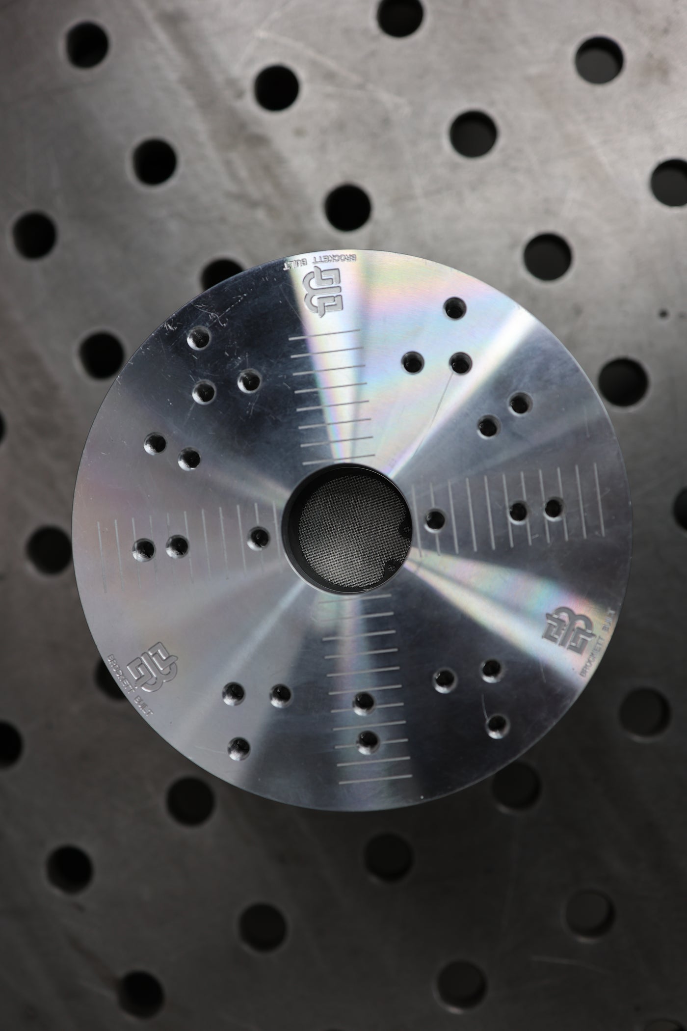 Flange welding fixture showing V-band adapter slot and clamp holes