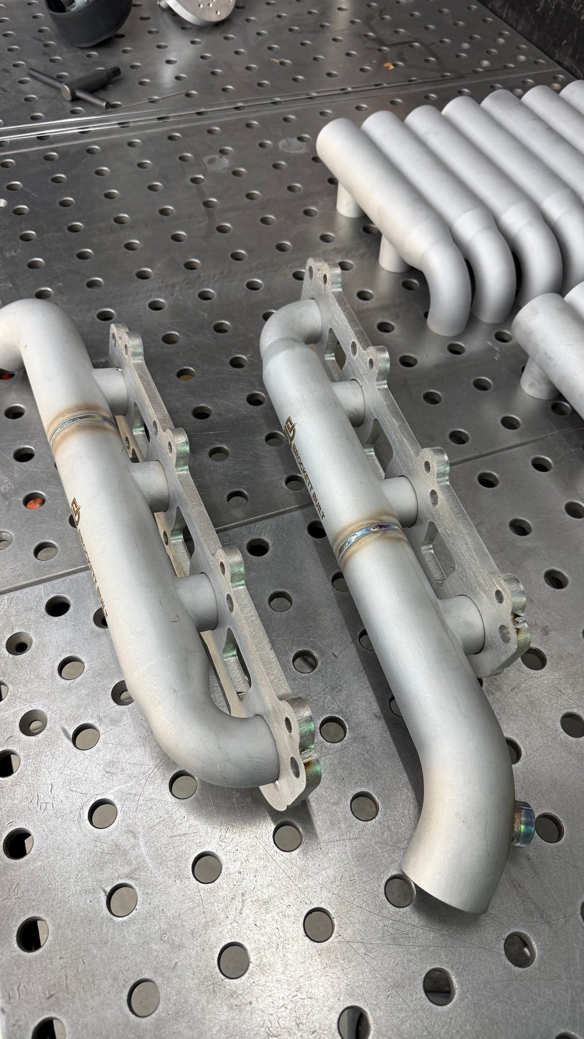 3/8in 304 stainless flanges on 2UZ-FE shorty log manifolds, side view