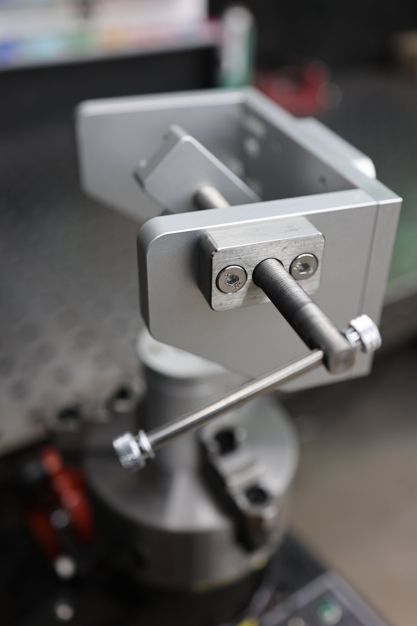 Detail of the stainless threaded rod and double T-handle clamping mechanism on the Tube Fixture