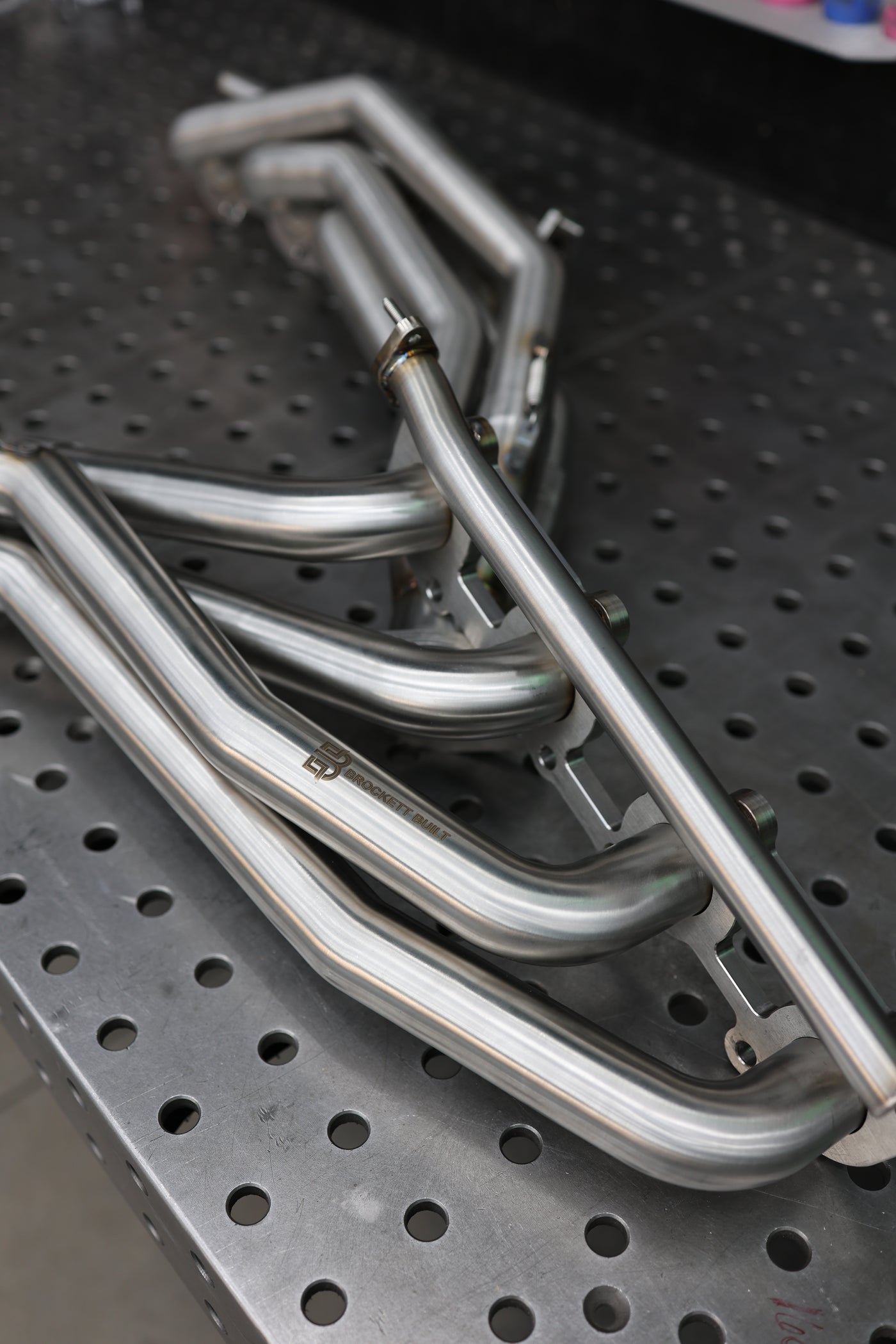 GX470 headers installed showing overall engine bay clearance
