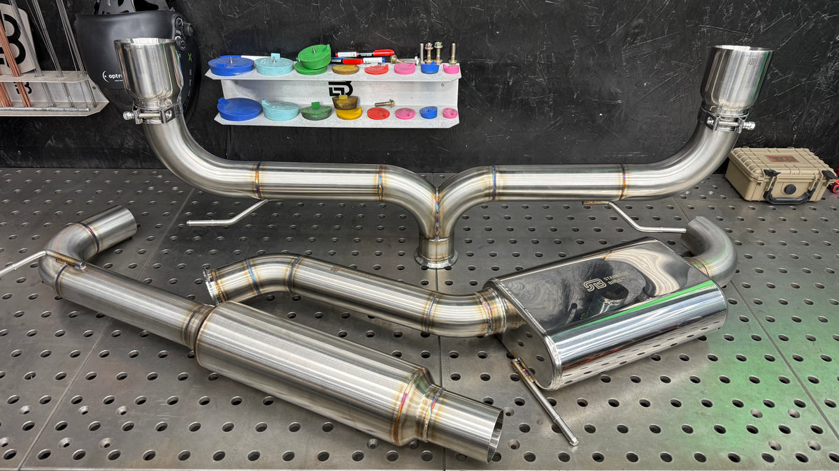 Full Aggressive cat-back system for the VW GTI showing the resonated mid-pipe, center muffler and straight-through dual exit rear section