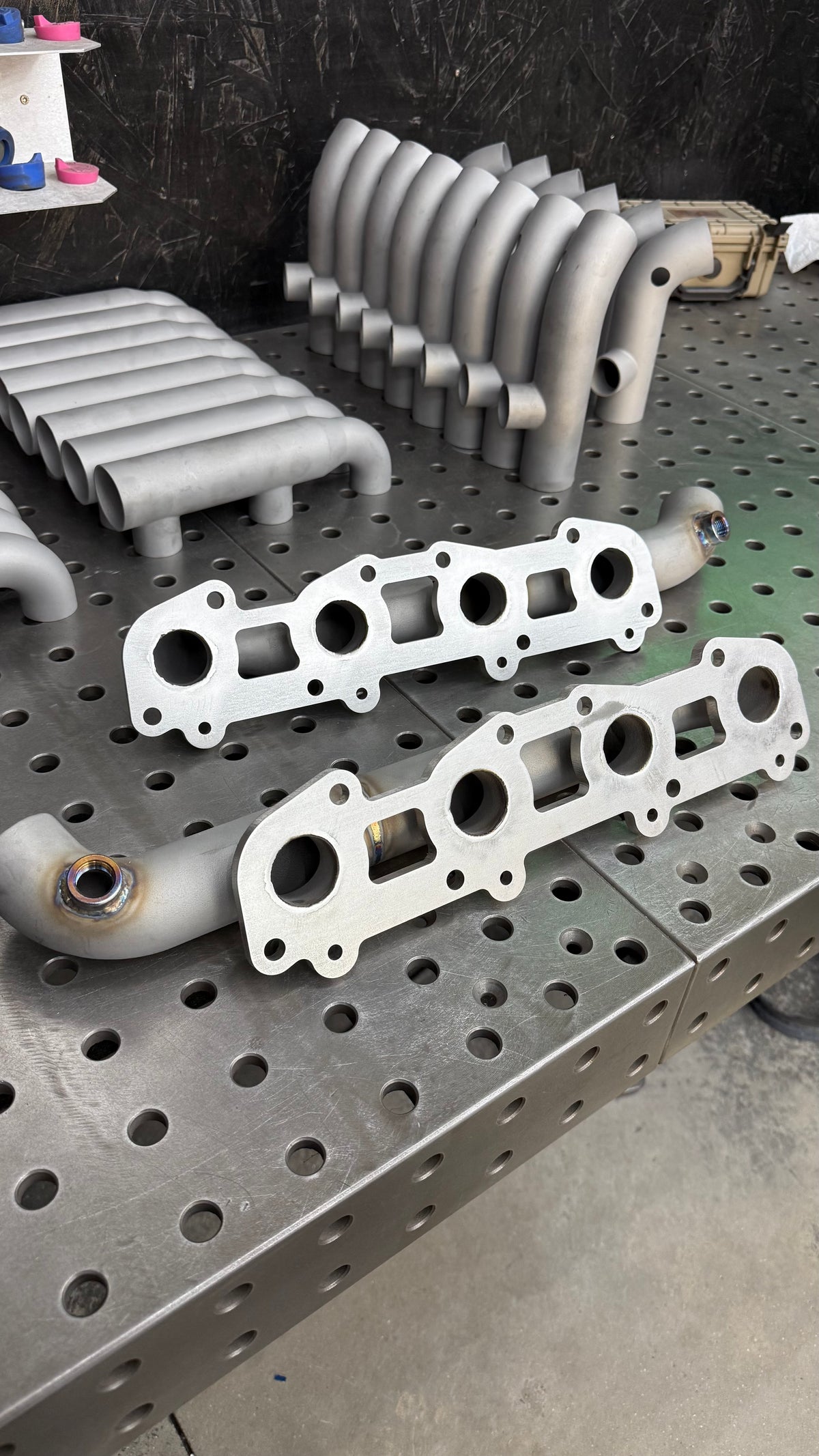 Close up of the 304 stainless head flanges on 3D printed 2UZ-FE log manifolds