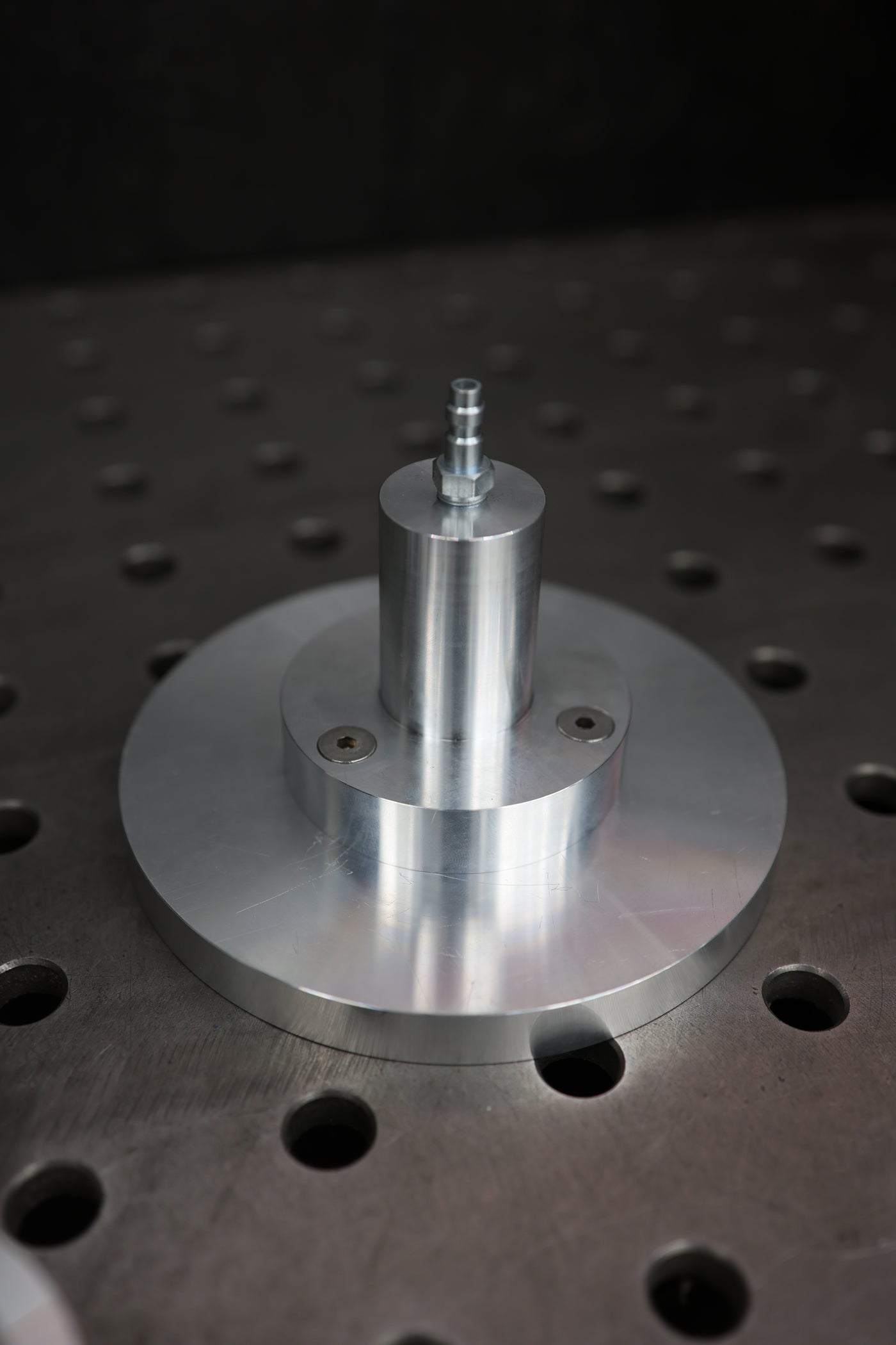 Flange welding fixture in use securing a flange for TIG welding