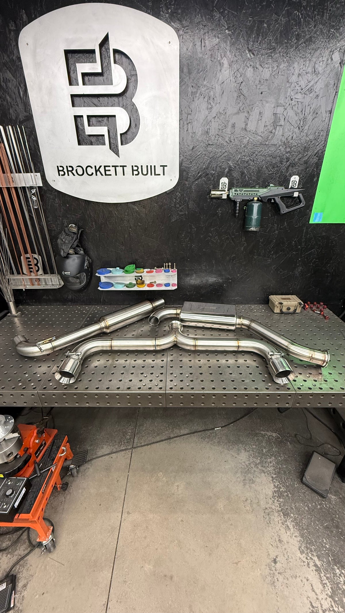 Brockett Built Aggressive cat-back for the VW GTI on the welding table in the Bartonville, Illinois shop