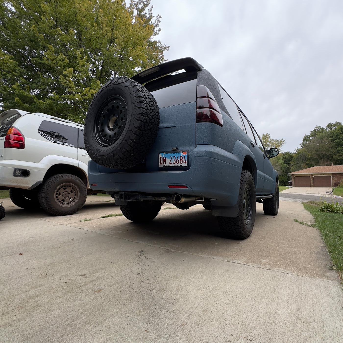 Modular catback exhaust showing mid-pipe section with flex joint
