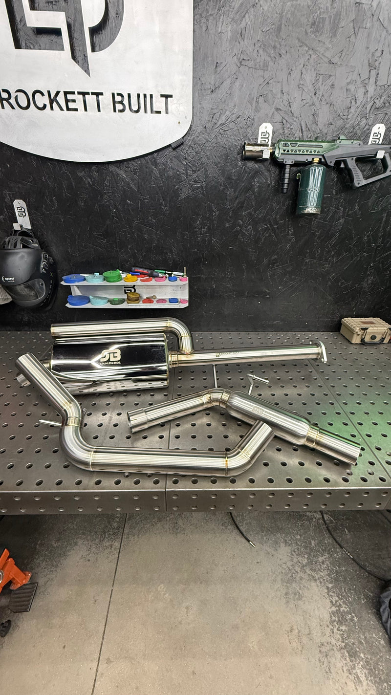 Brockett Built modular catback exhaust for GX470, GX460 and V8 4Runner laid out on the welding table