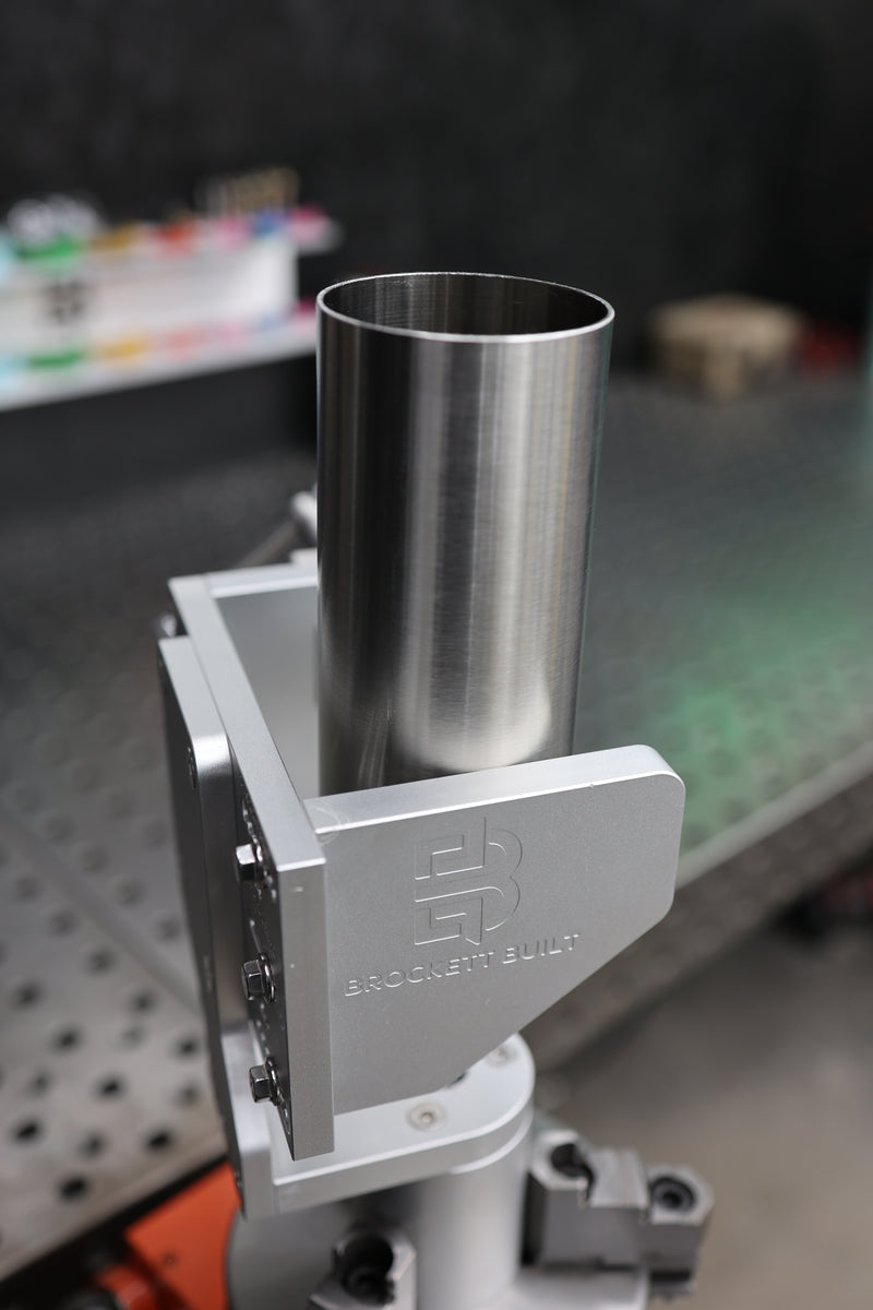 Brockett Built Tube Fixture holding stainless steel tube on a welding positioner for rotational TIG welding