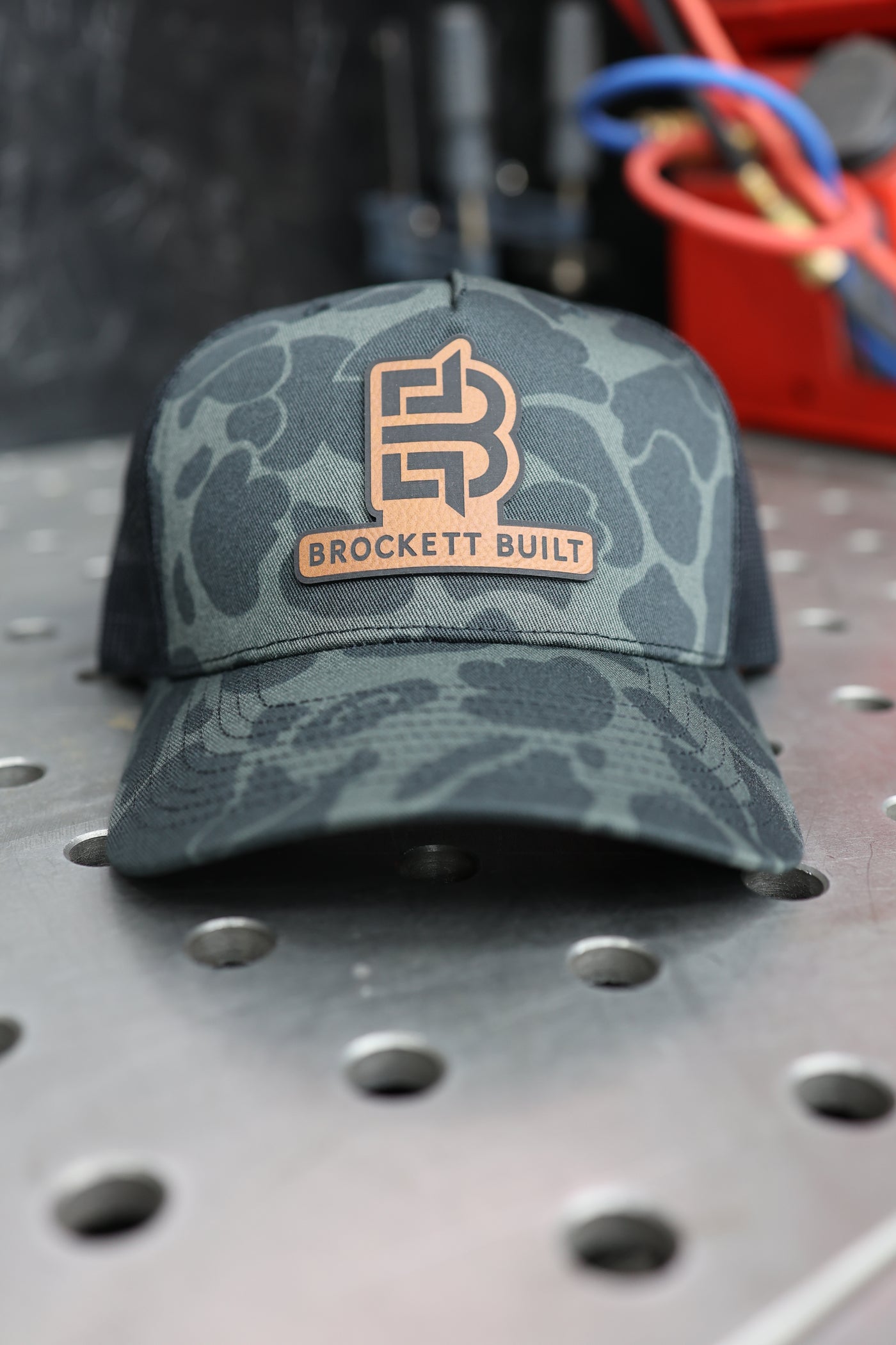 Brockett Built snapback hat brim close-up showing duck camo pattern