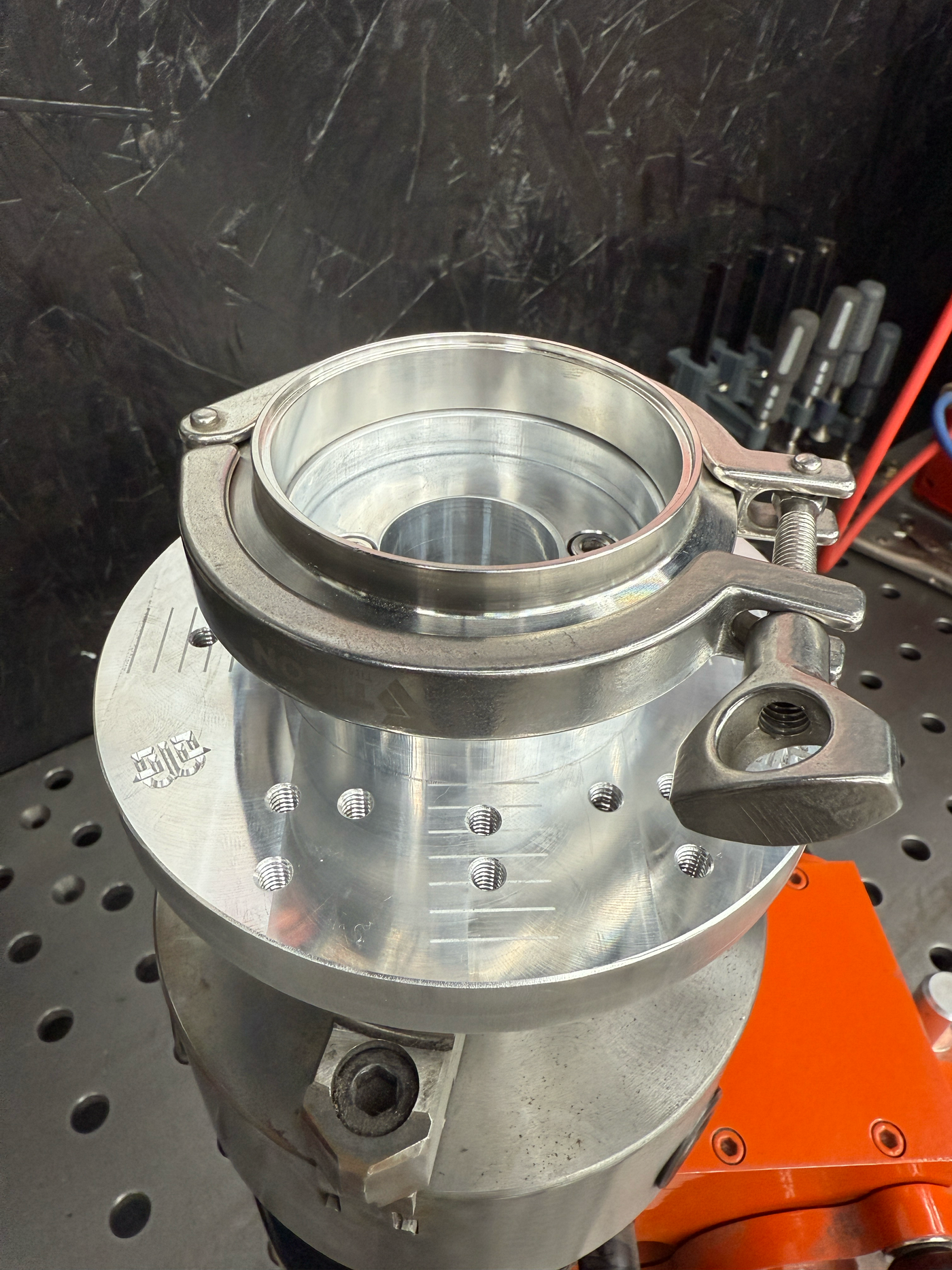 V-band adapter close-up showing precision machined fit