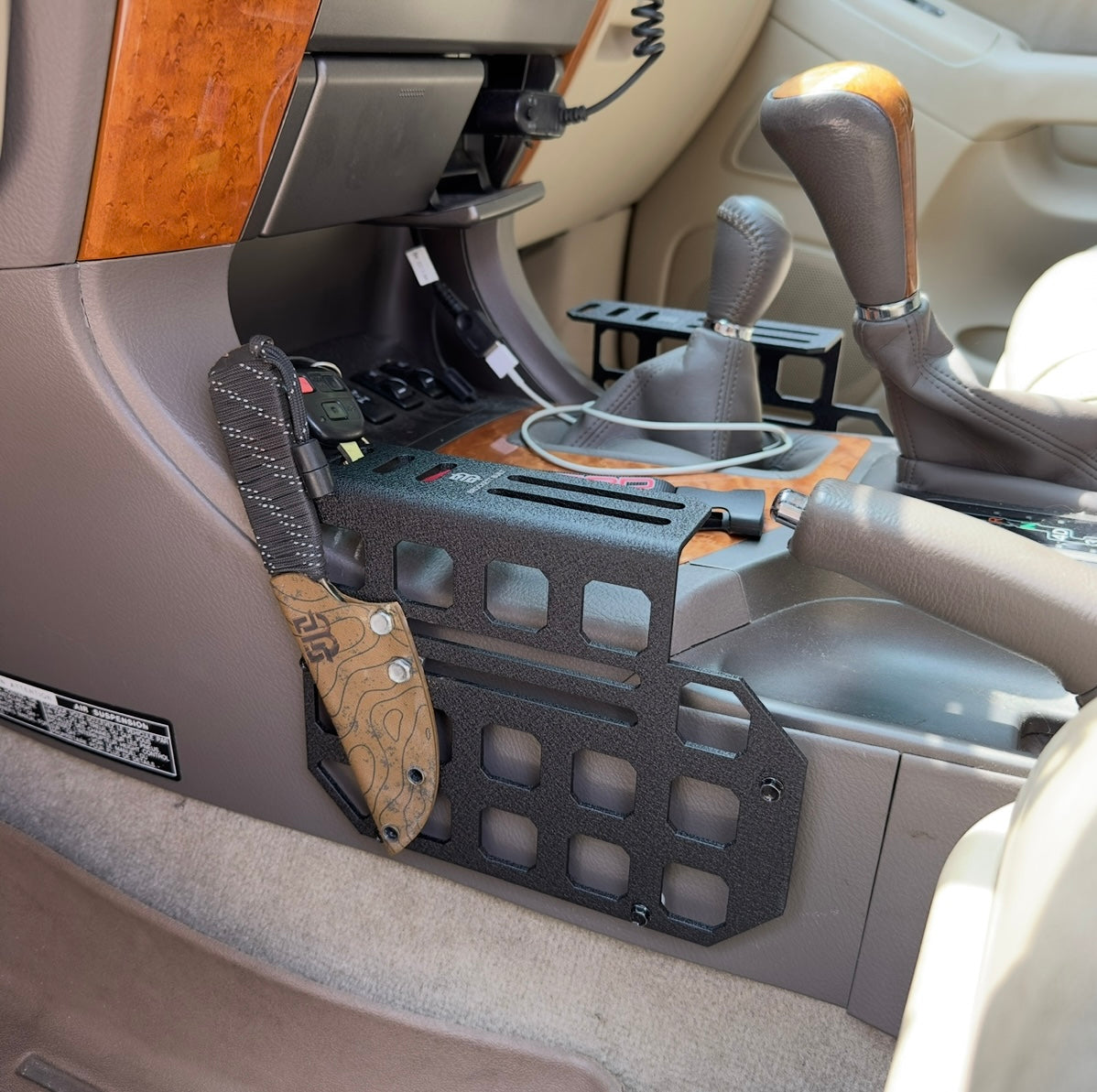 GX470 center console MOLLE panels installed with wrinkle black powder coat