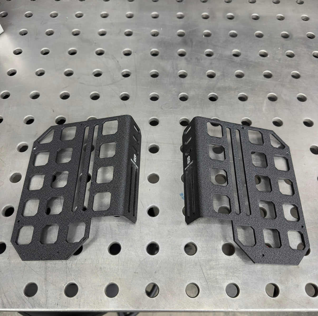 GX470 center console MOLLE panel close-up showing laser-cut pattern