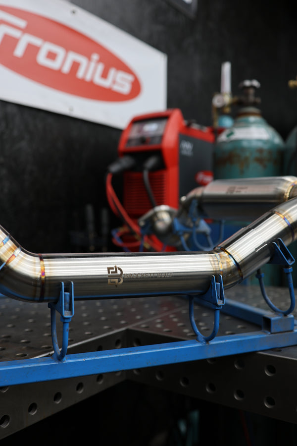 304 stainless Y-pipe on the welding fixture in the Brockett Built shop