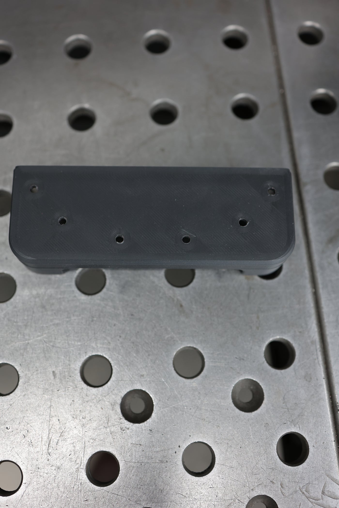 Nova foot pedal lip installed on Miller Dynasty wireless foot pedal