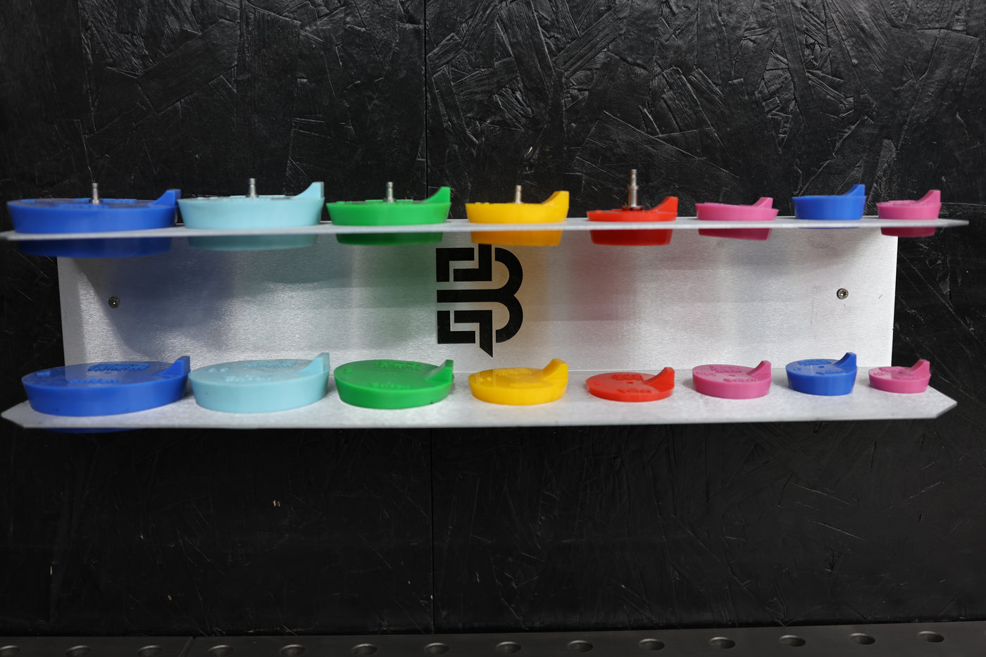 Purge plug bracket mounted in shop with plugs organized