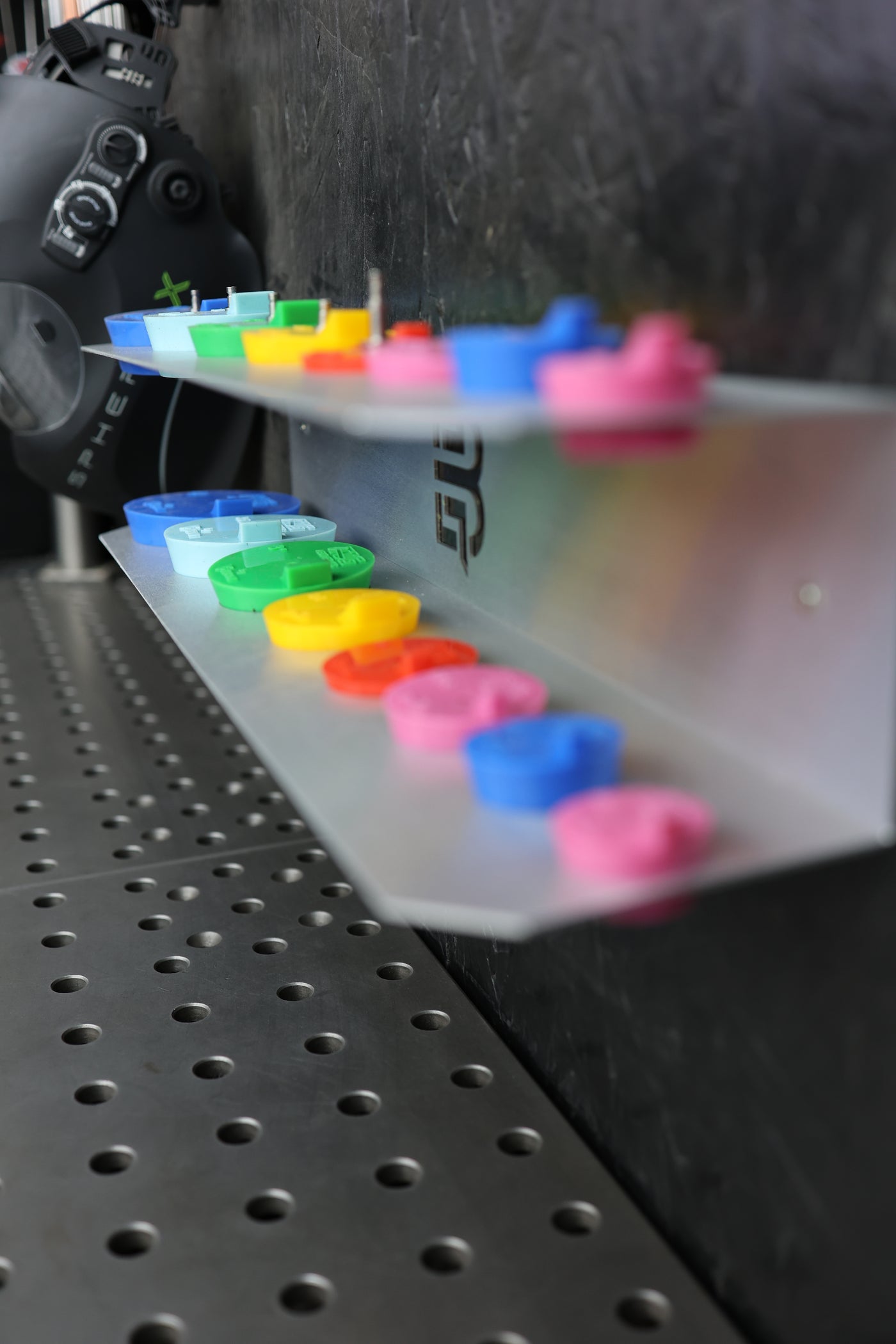 Purge plug bracket close-up showing plug slots