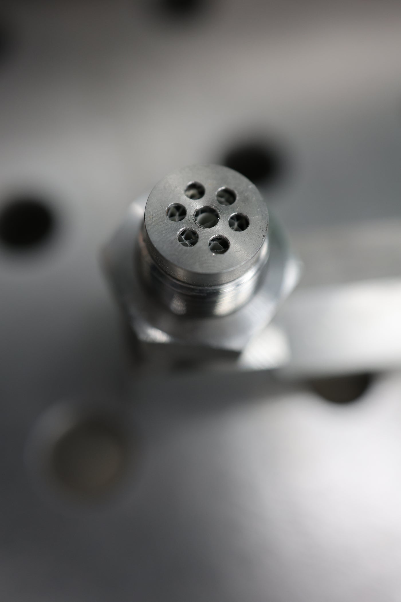 O2 sensor spacer close-up showing mini cat and bung thread detail