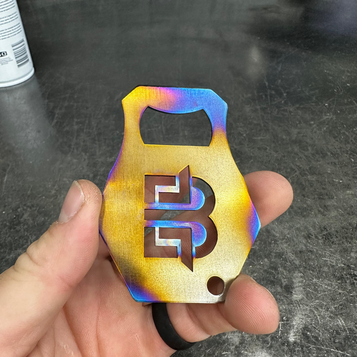 Bottle opener in wrinkle black powder coat finish