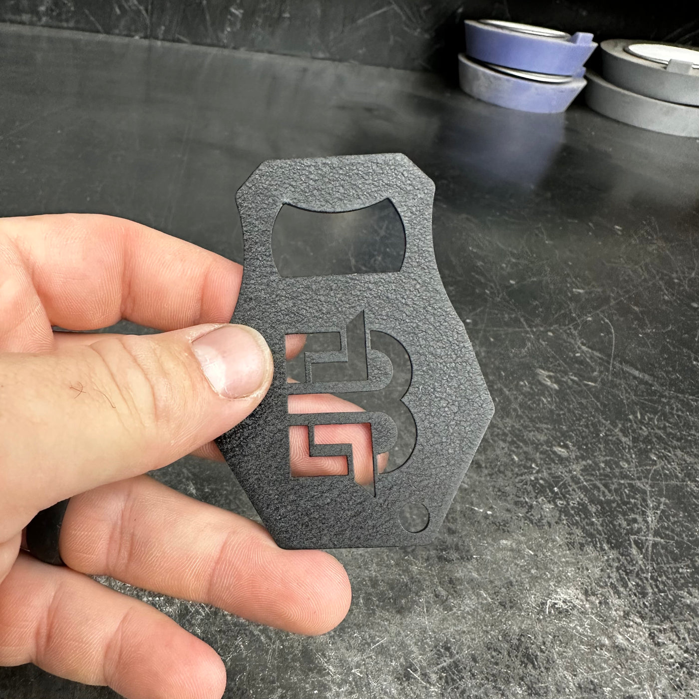 Bottle opener in use opening a bottle