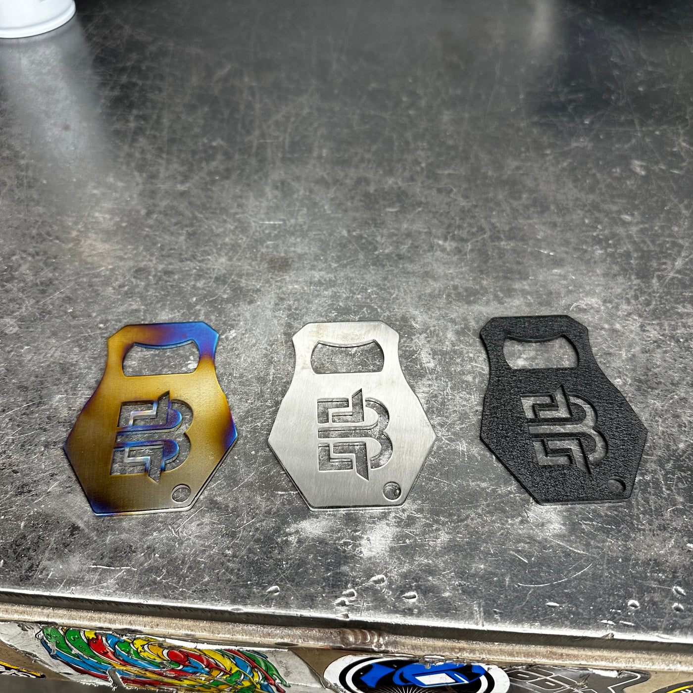 Bottle opener close-up showing fabricated stainless body