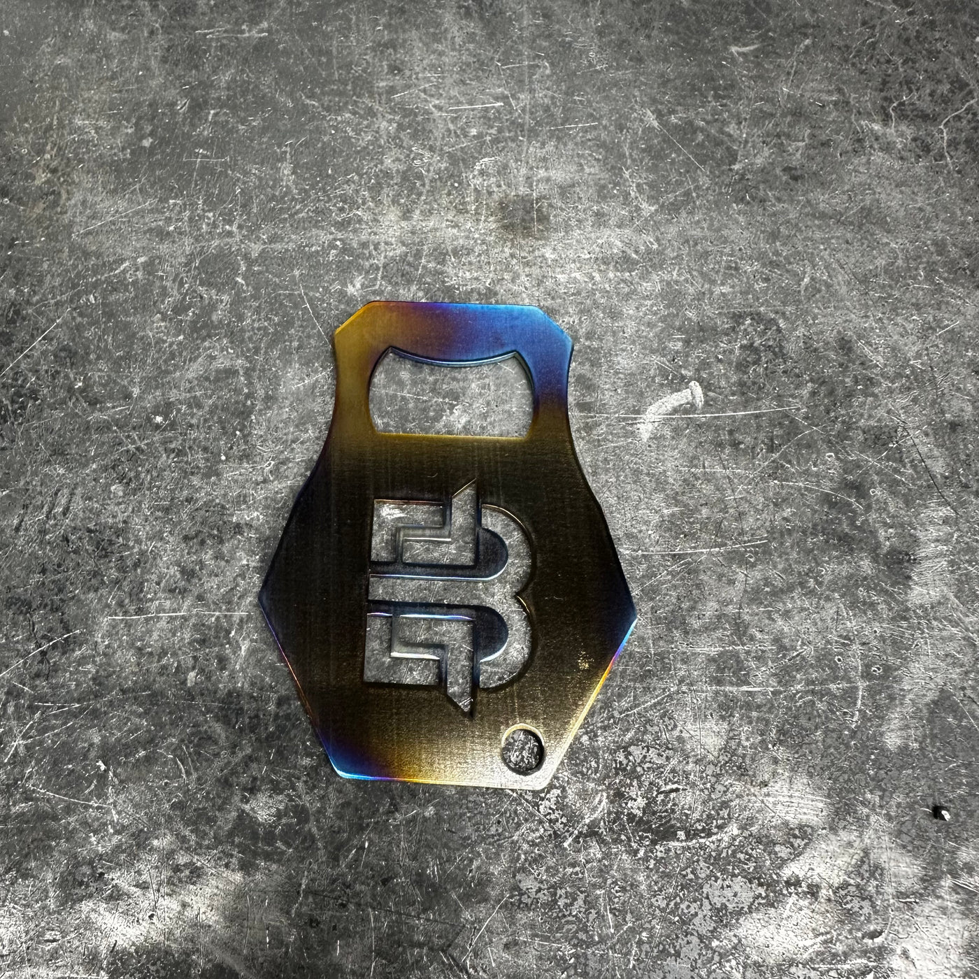 Brockett Built handcrafted bottle opener in burnt titanium finish