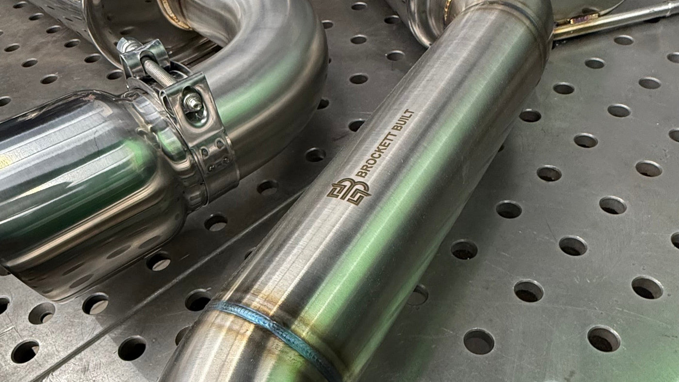 Laser etched Brockett Built logo and TIG welded, back purged 304 stainless bend on the GTI Stealth cat-back with a band clamp joint