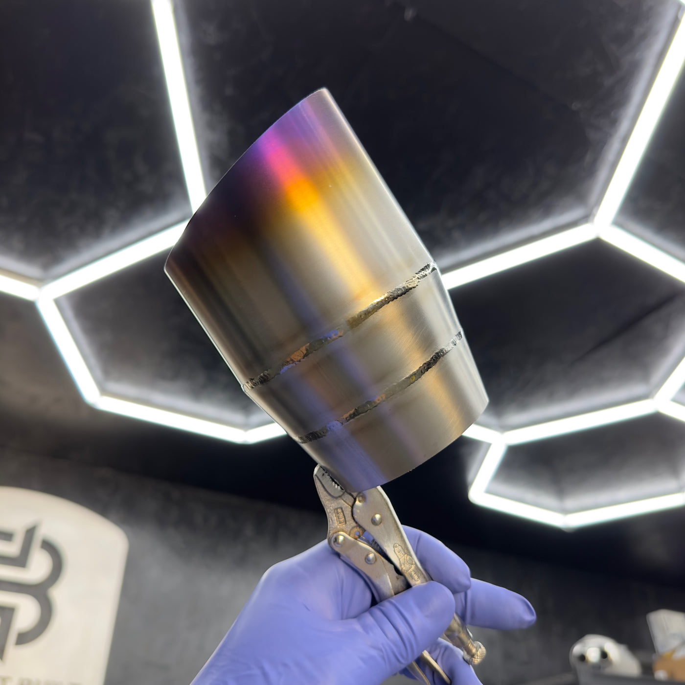 Titanium exhaust tip slash cut style showing burnt color spectrum