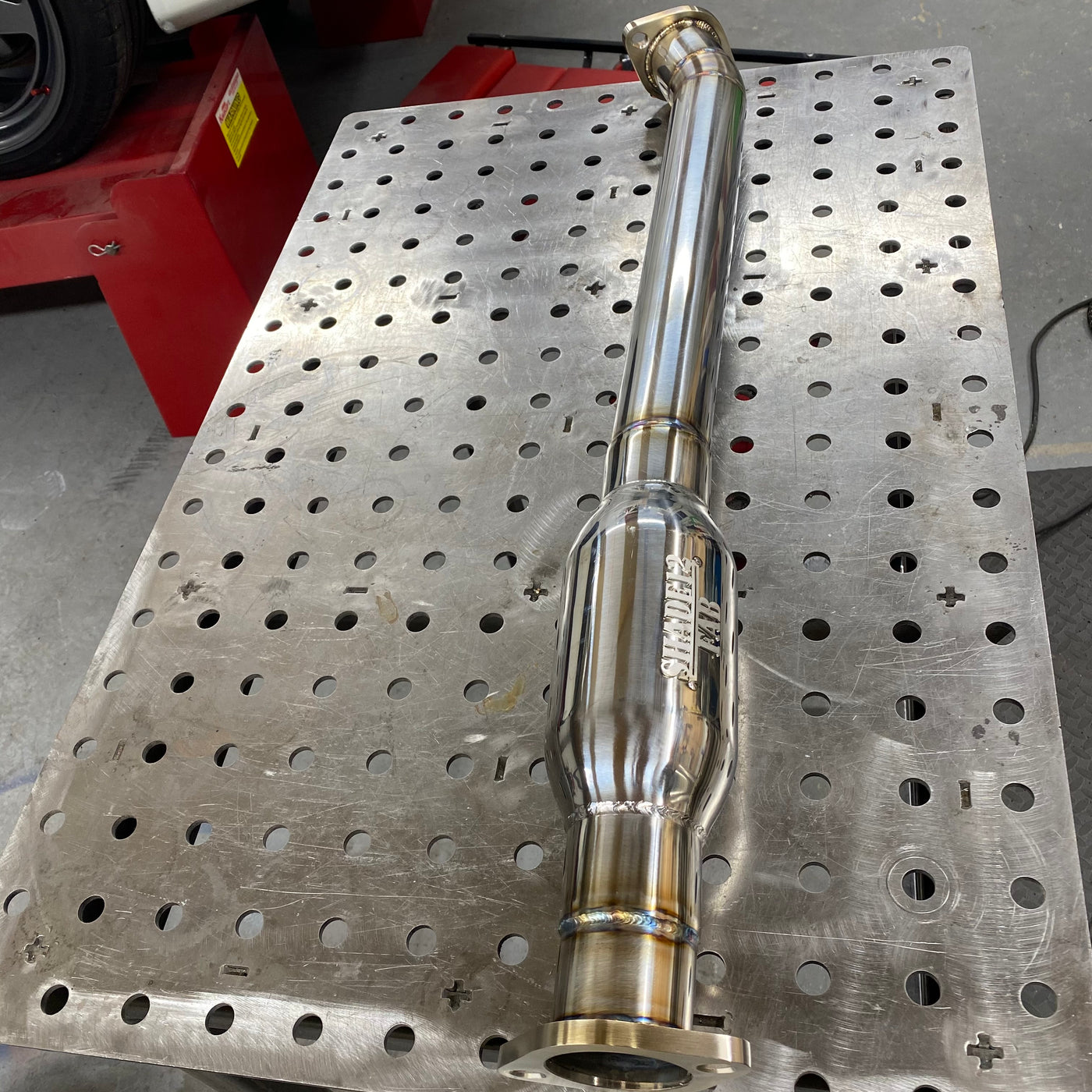 IS300 resonator pipe showing inlet and outlet connections