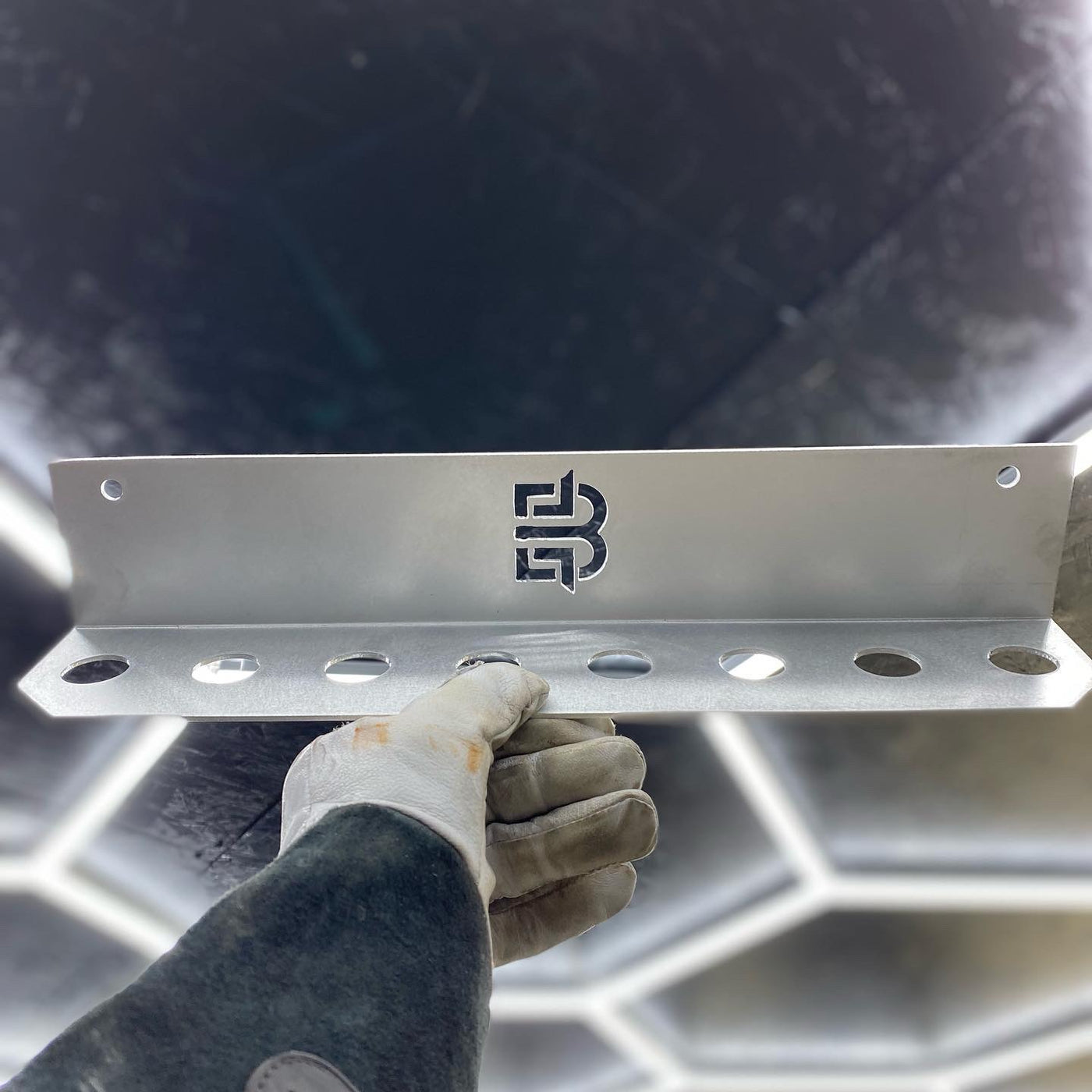 Filler rod bracket side view showing 1-inch rod holes